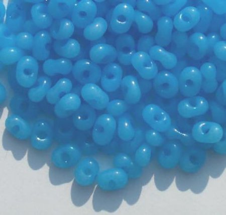 25 grams of 3x7mm Milky Blue Farfalle Seed Beads