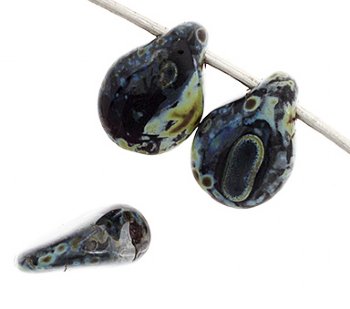 69, 5x7mm Opaque Black Travertine Pip Beads