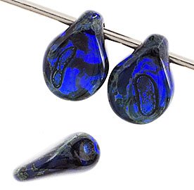 69, 5x7mm Transparent Dark Blue Travertine Pip Beads