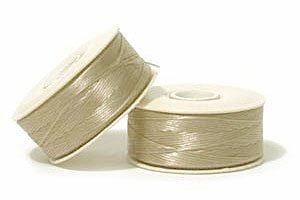 64 Yards of Champagne D Nymo Thread