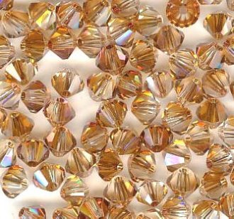 25 4mm Crystal Copper Bicone Swarovski